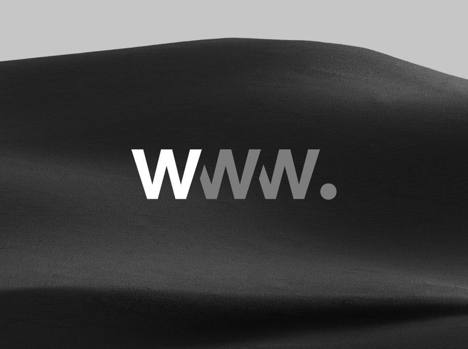 Awwwards logo in white over a dark sand dune in black and white.