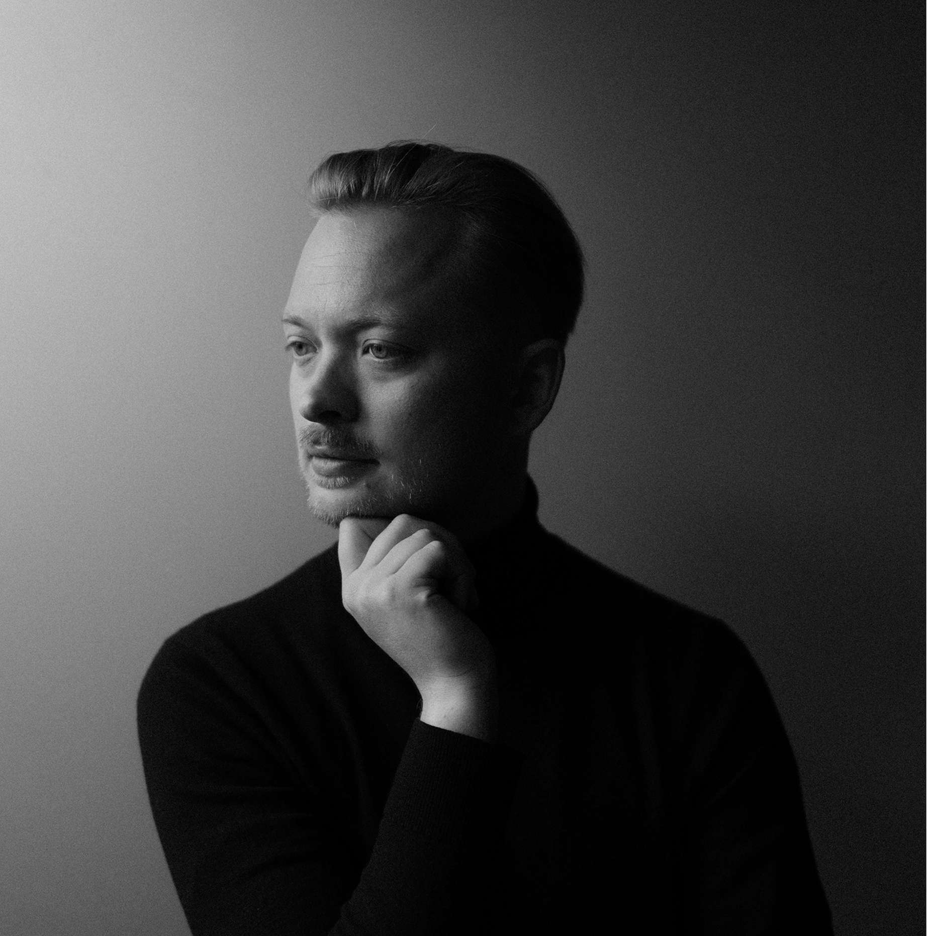 Portrait of Steffen Christiansen in black and white.