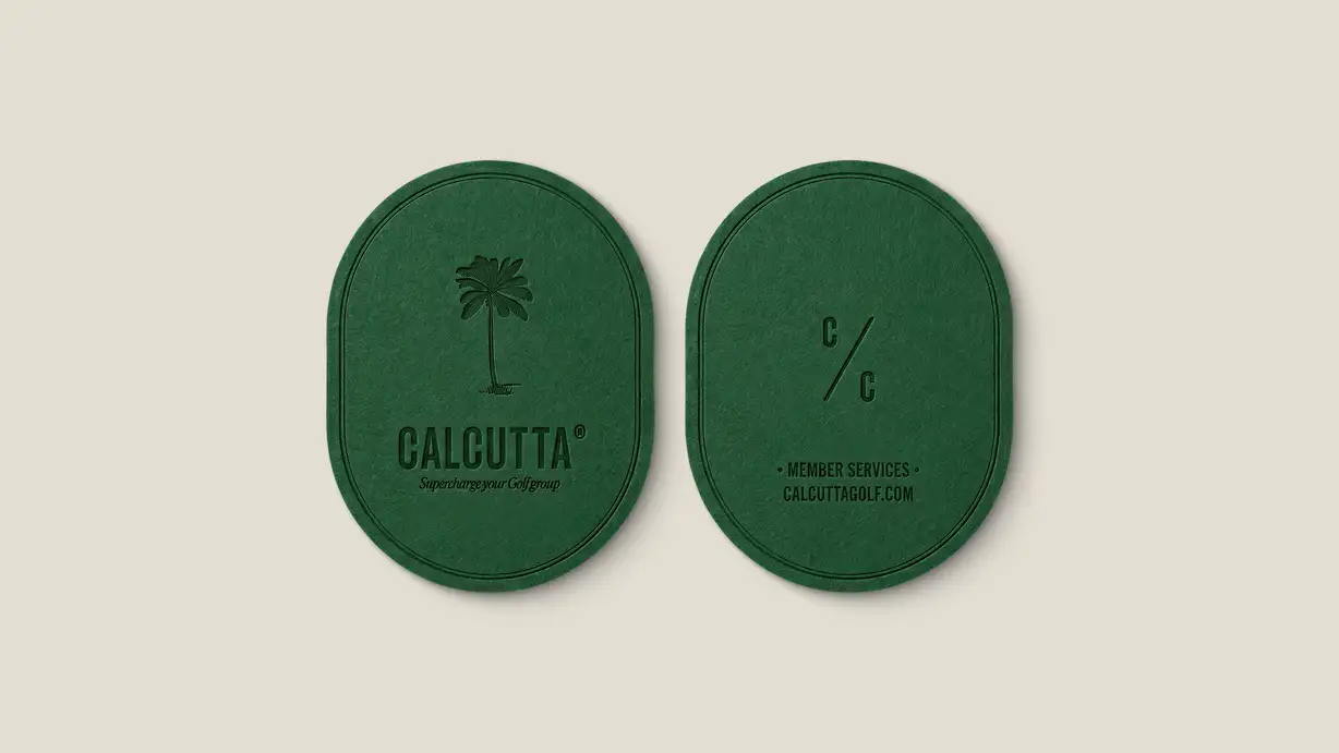 Two oval forest-green coasters (or branded cards) shown front and back on a cream background, with subtle embossed/debossed detailing. The left coaster features an illustrated palm tree above the "CALCUTTA®" wordmark and the tagline "Supercharge your Golf group." The right coaster shows the "C/C" monogram (two C's split by a diagonal slash) above the text "• MEMBER SERVICES • CALCUTTAGOLF.COM." The tonal green-on-green printing gives an elegant, premium finish.