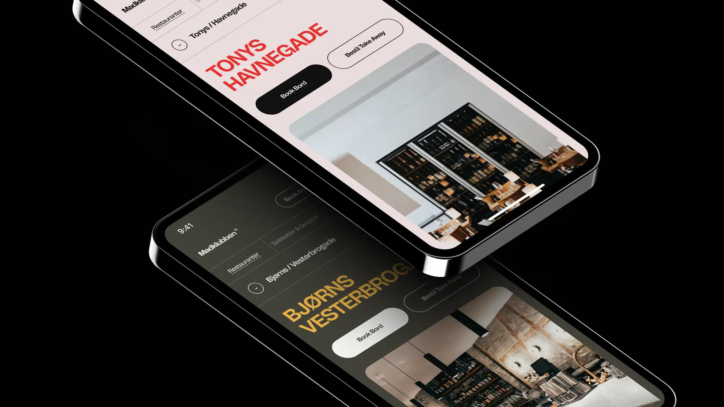 Two overlapping smartphone mockups on a black background, tilted at angles, each showing a Madklubben restaurant page. The upper phone displays 'Tonys Havnegade' in bold red type on a light pink background, with 'Book Bord' and 'Bestil Take Away' buttons above a photo of a dimly lit restaurant with wine shelves and wood furniture. The lower phone displays 'Bjørns Vesterbrogade' in bold gold type on a dark background, with matching 'Book Bord' and 'Bestil Take Away' buttons above a photo of an industrial-style space with exposed pipes, brick walls, and dark cabinetry."  Shorter version: "Two tilted smartphone mockups showing Madklubben restaurant pages for Tonys Havnegade (light theme, red text) and Bjørns Vesterbrogade (dark theme, gold text), each with Book Bord and Take Away buttons over interior photos.