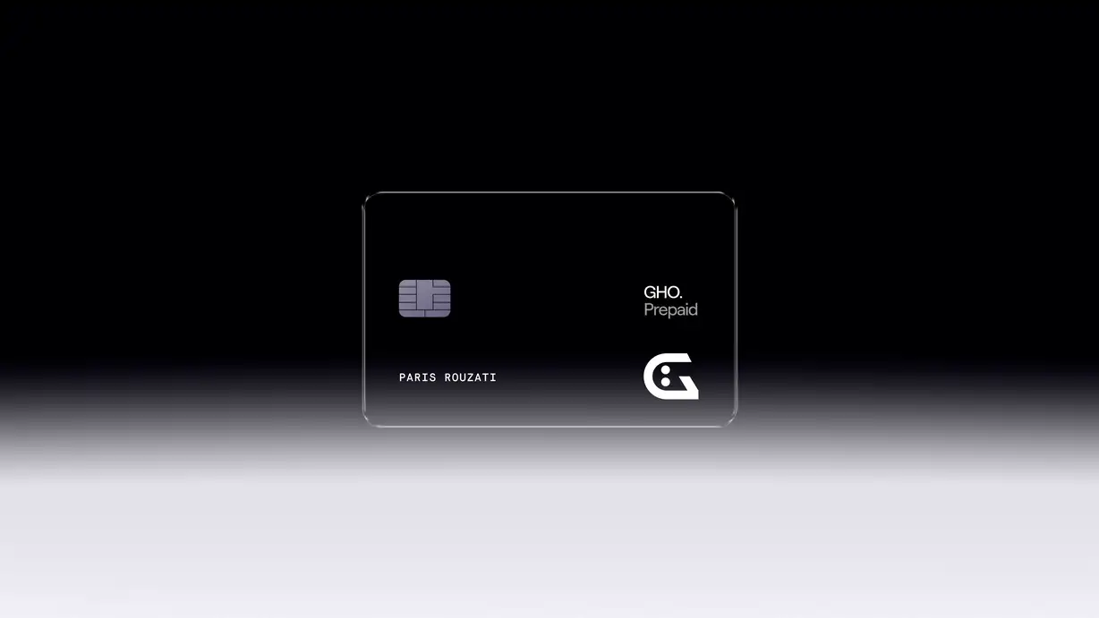 Transparent GHO Prepaid card with a chip, logo, and text against a gradient background.