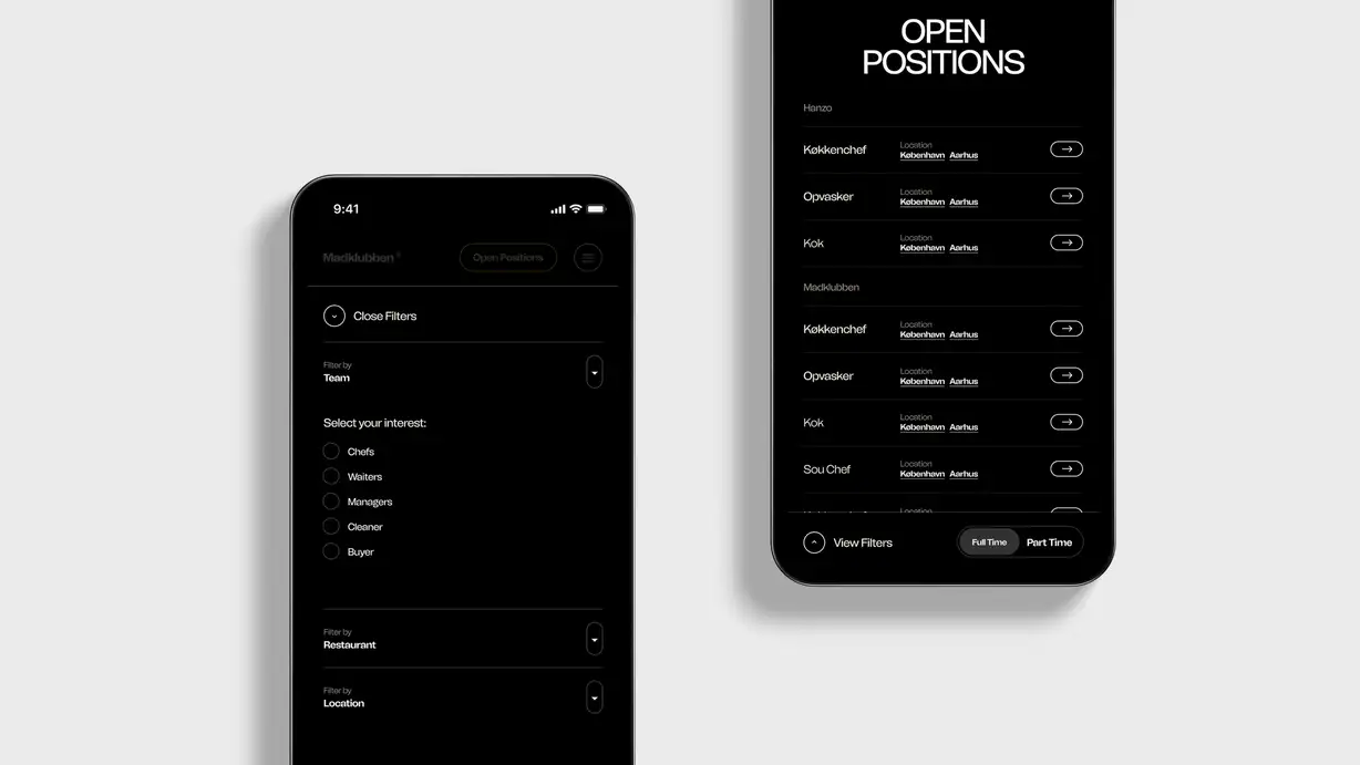 Two smartphone mockups on a light gray background showing a Madklubben job listings page in dark mode. The left phone displays a filter panel with 'Close Filters' and dropdowns for Team, Restaurant, and Location, plus a 'Select your interest' list of radio options: Chefs, Waiters, Managers, Cleaner, and Buyer. The right phone shows the 'OPEN POSITIONS' results list grouped by restaurant, with Hanzo and Madklubben sections listing roles like Køkkenchef, Opvasker, Kok, and Sou Chef alongside Location tags for København and Aarhus and arrow buttons to view each listing, with a 'View Filters' toggle and 'Full Time / Part Time' switch fixed at the bottom.