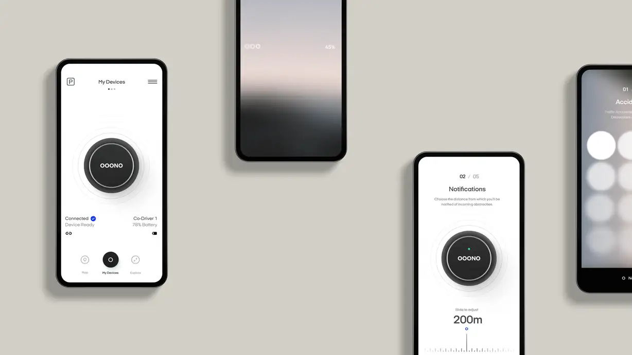 Four smartphones arranged on a warm gray background, each displaying a screen from the OOONO Co-Driver companion app. The left phone shows the "My Devices" screen: a large black circular OOONO device icon surrounded by concentric rings, with status text reading "Connected — Device Ready" and "Co-Driver 1 — 78% Battery," plus a bottom navigation bar with Map, My Devices, and Explore tabs. The top-center phone shows a mostly blurred gradient screen with a "45%" progress indicator and three dots. The lower-right phone shows step "02 / 05 — Notifications," reading "Choose the distance from which you'll be notified of incoming obstacles," with the black OOONO icon above a slider set to "200m — Slide to adjust." The far-right phone, partially cut off, shows an onboarding screen labeled "01 — Accidents" about traffic accidents and distractions, with rows of soft white circular icons.
