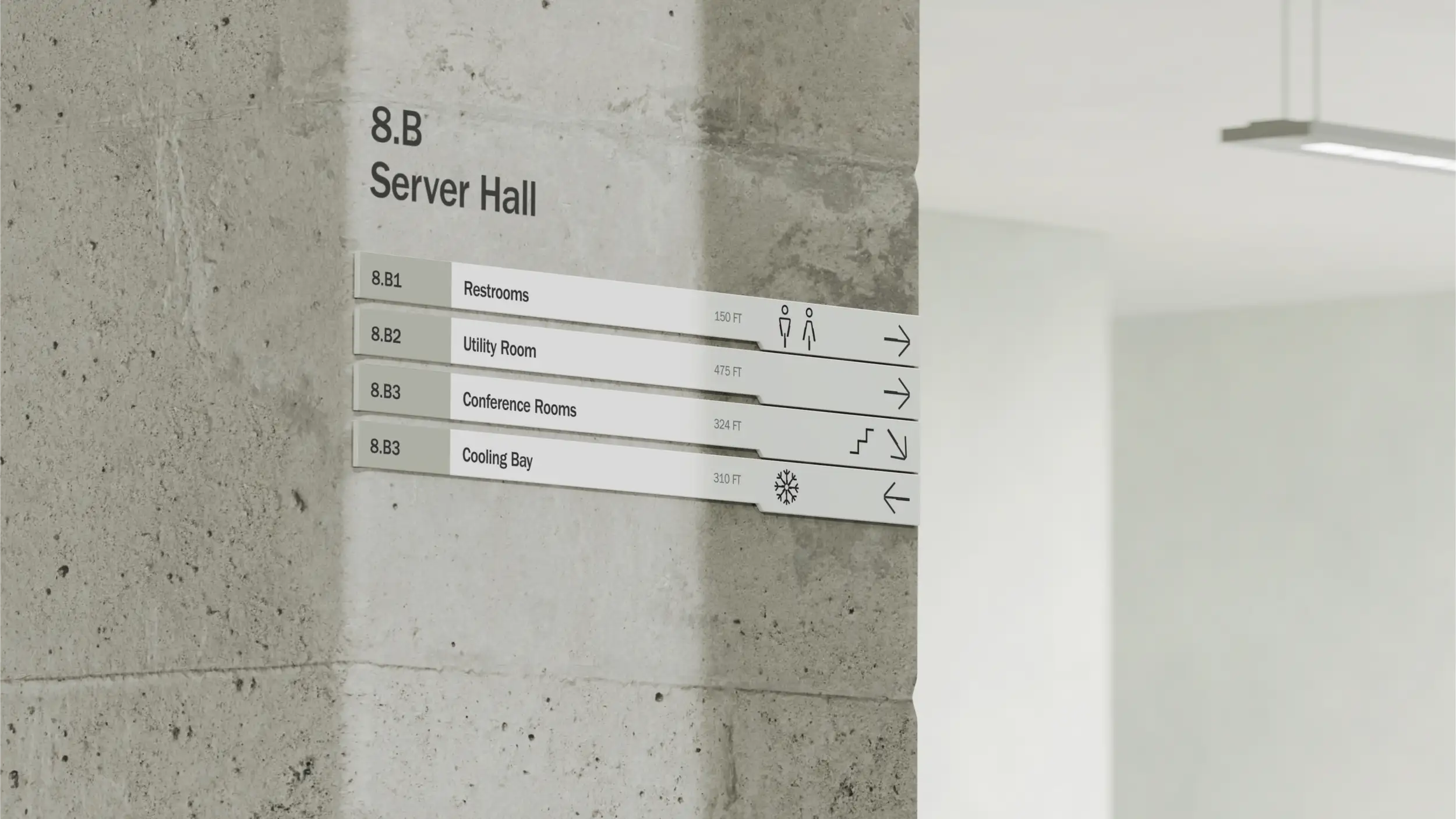 A directional wayfinding sign mounted on an exposed gray concrete pillar in a minimalist industrial interior, with a suspended linear light fixture visible on the blurred white wall to the right. The sign is headed "8.B — Server Hall" in black type. Below are four horizontal directory bars, each with a room code, label, distance, icon, and direction arrow: "8.B1 Restrooms — 150 FT" (restroom figures, arrow right), "8.B2 Utility Room — 475 FT" (arrow right), "8.B3 Conference Rooms — 324 FT" (stairs and down-right arrow), and "8.B3 Cooling Bay — 310 FT" (snowflake icon, arrow left).