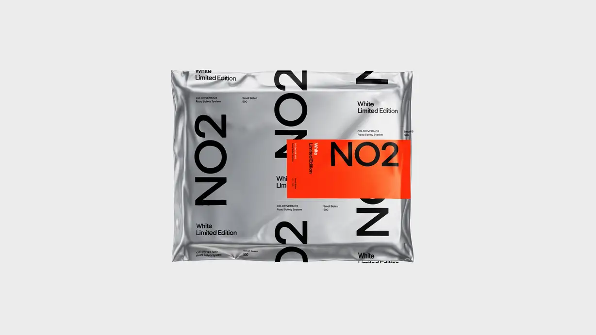 A silver reflective mylar packaging bag repeatedly printed with "NO2," "White Limited Edition," and product details, with an orange label overlay reading "NO2 / White Limited Edition" centered on top.